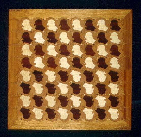 chessboard: a kangaroo and australian continent tessellation carved from thin plywood by a laser